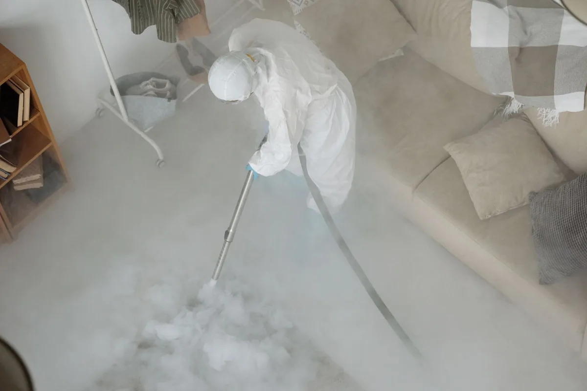 Biohazard cleanup technician in protective equipment, Erwin, TN